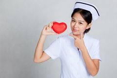 A nurse holding a heart - Atlanta, GA - Progressive Growth Coaching