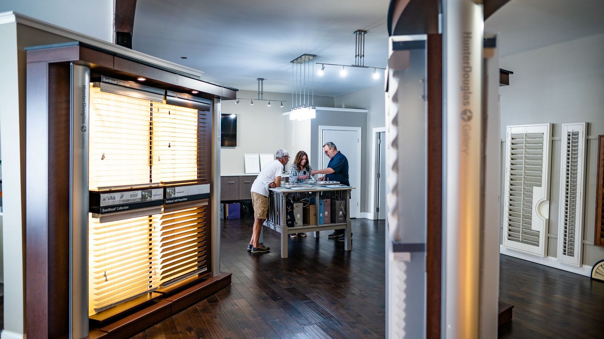 Blind & Shutter Gallery team helping a customer in Hunter Douglas showroom near Brentwood, TN