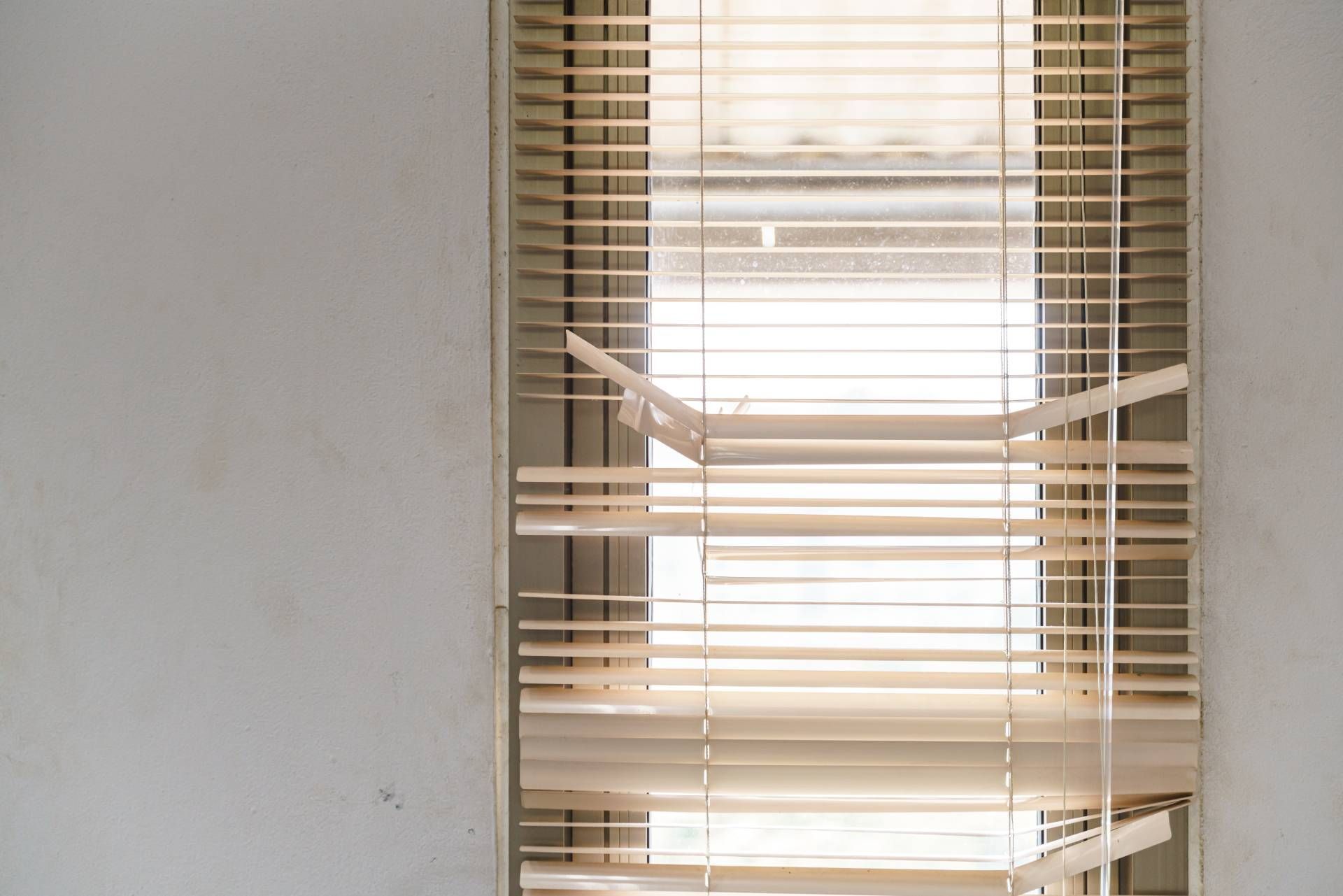 A set of damaged window blinds in need of replacement near Nashville, TN