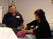A man and a woman are sitting next to each other in a room.
