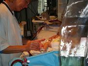 A nurse is working on a baby in a hospital.