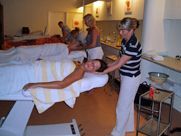 A group of people are getting a massage in a spa.