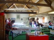 A group of people are sitting at tables in a room.