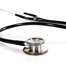 A close up of a stethoscope on a white surface.