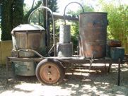 A large copper barrel is sitting on top of a trailer.