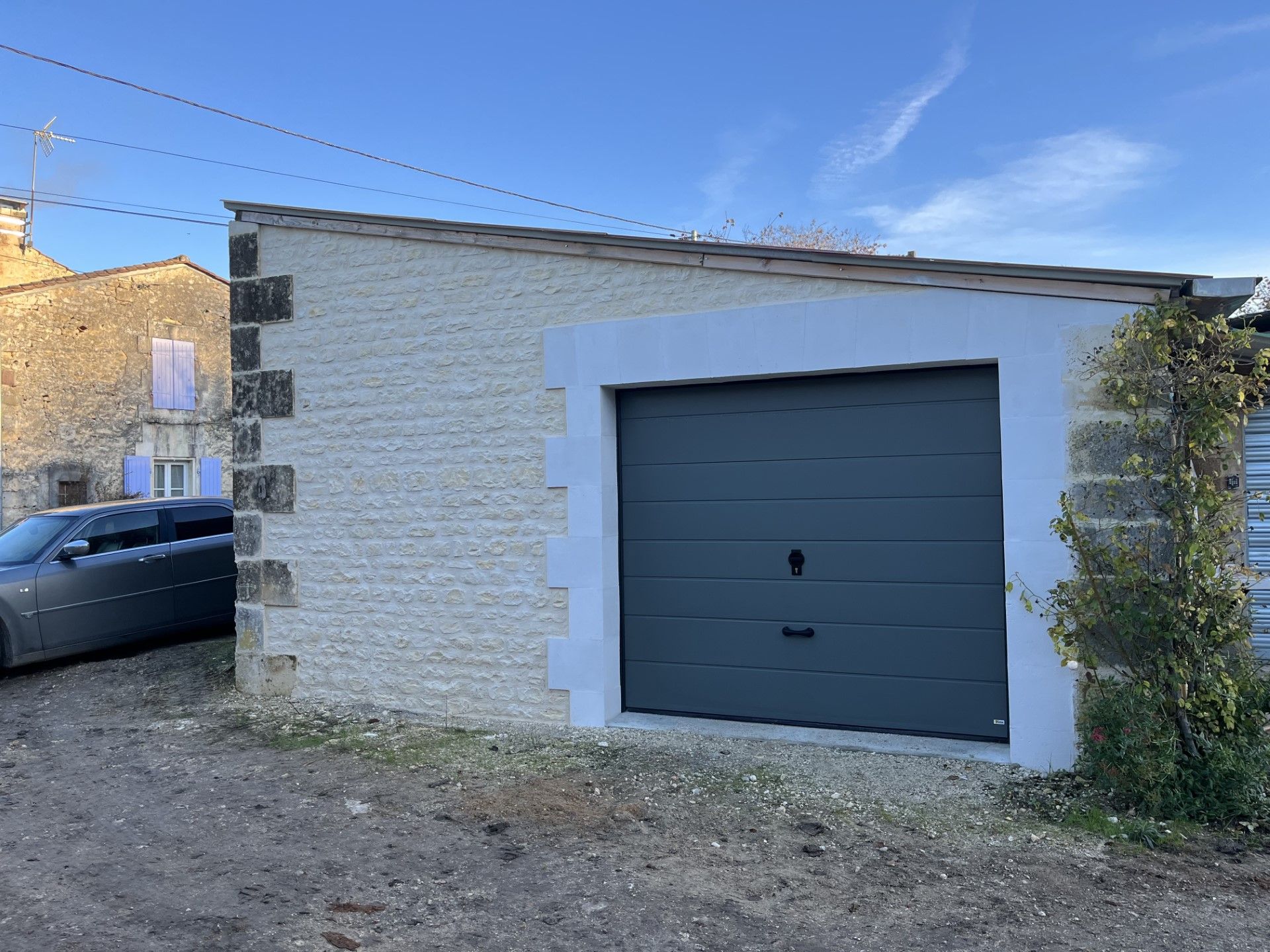 Création d'une porte de garage dans un mur maçonné