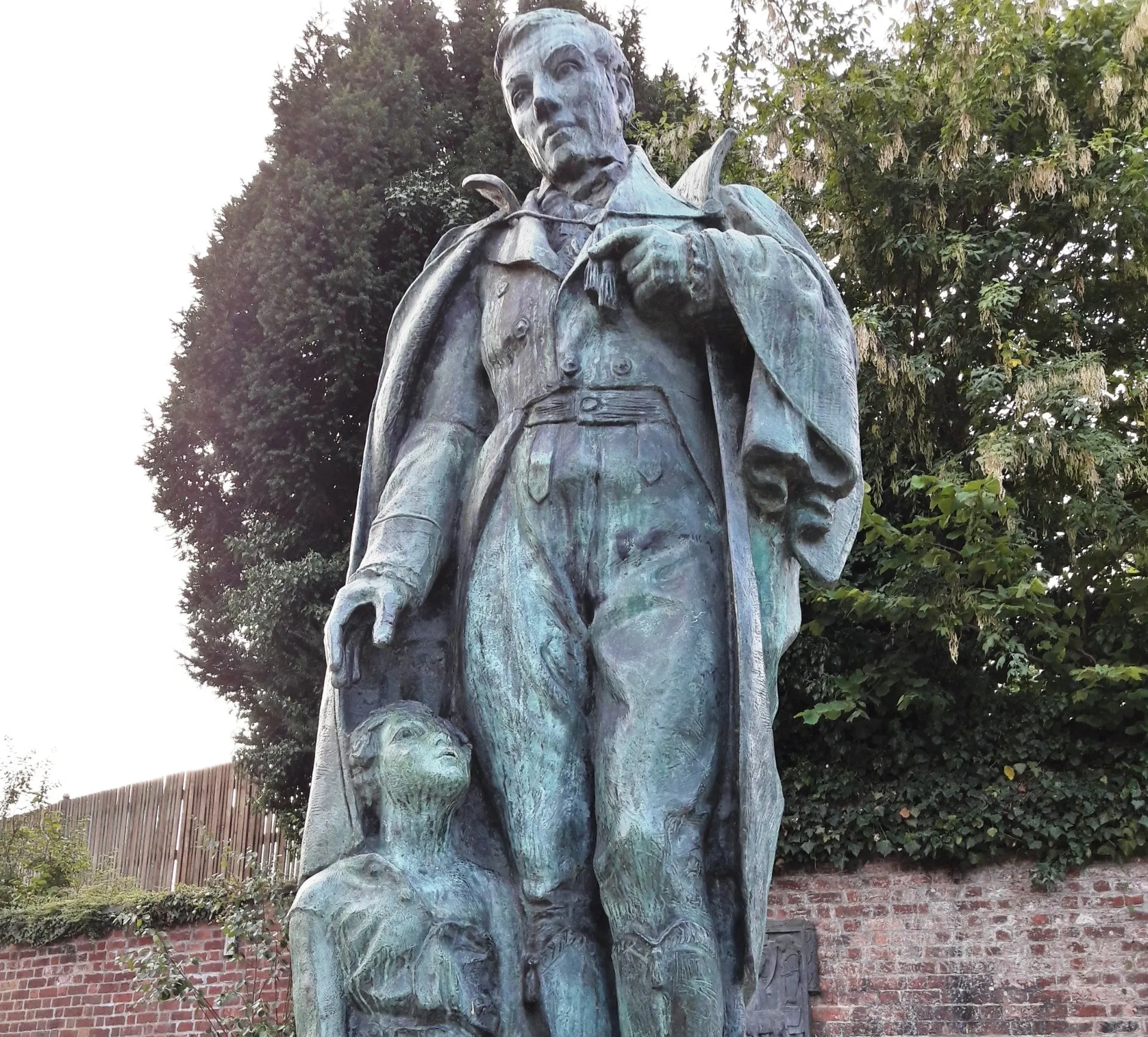 Robert Owen Statue in Newtown. He is with a child because he pioneered education for all children.