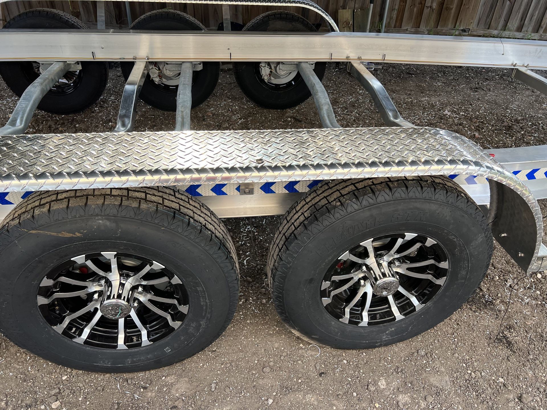 A close up of a trailer with two tires on it