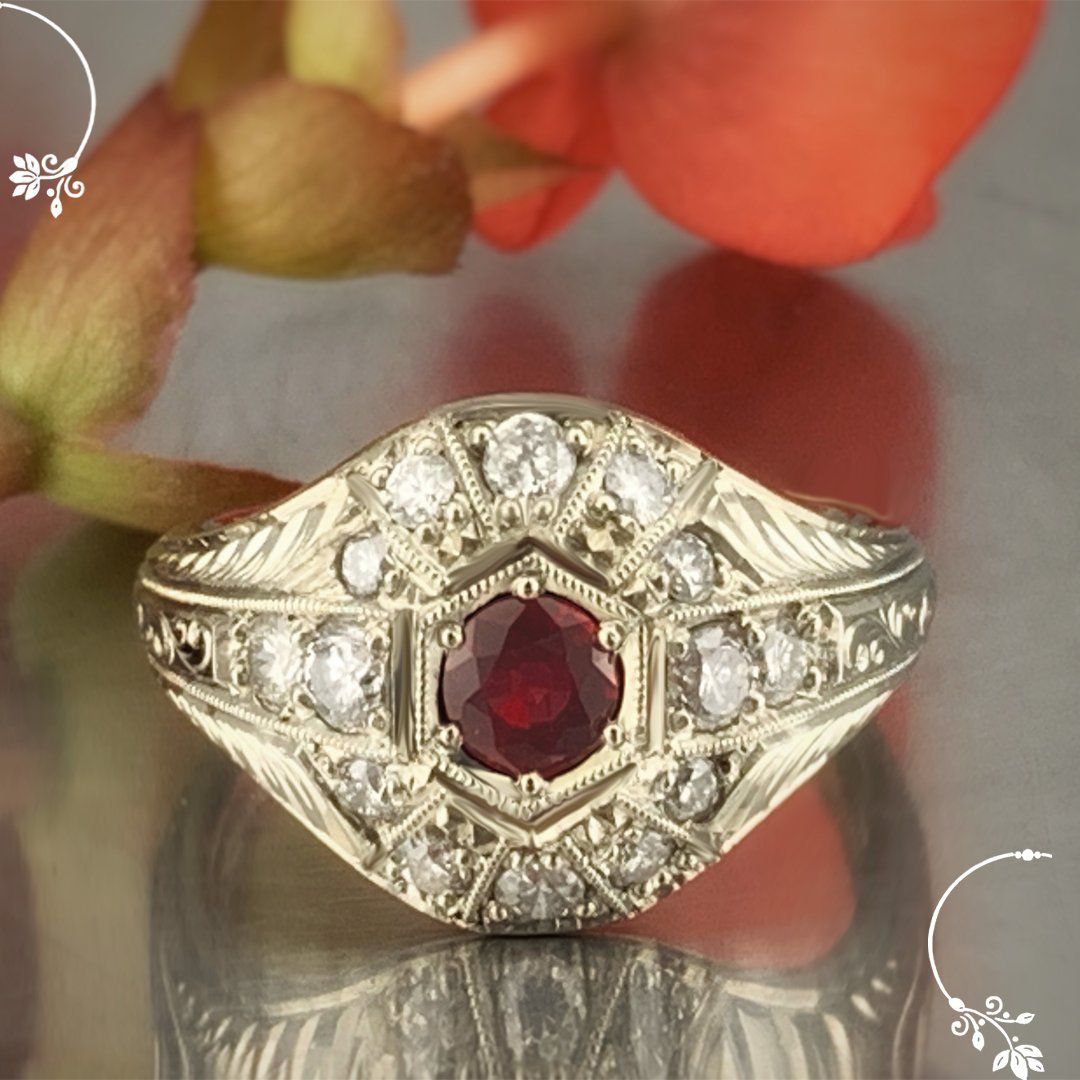 A gold ring with a red stone and diamonds