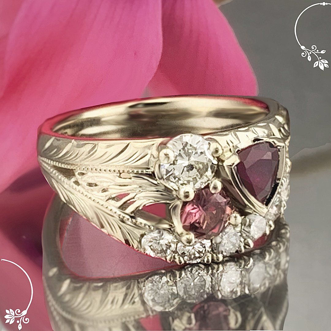 A gold ring with a pink stone and diamonds