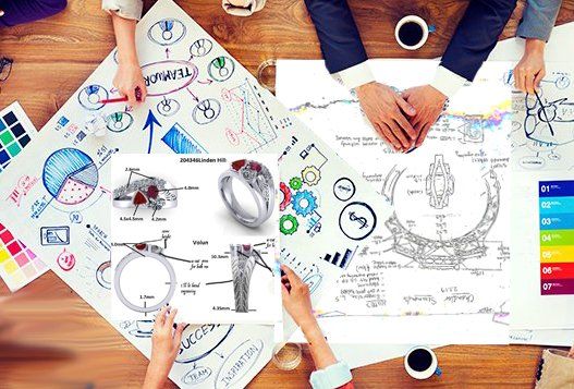 A group of people are sitting around a table working on a project.