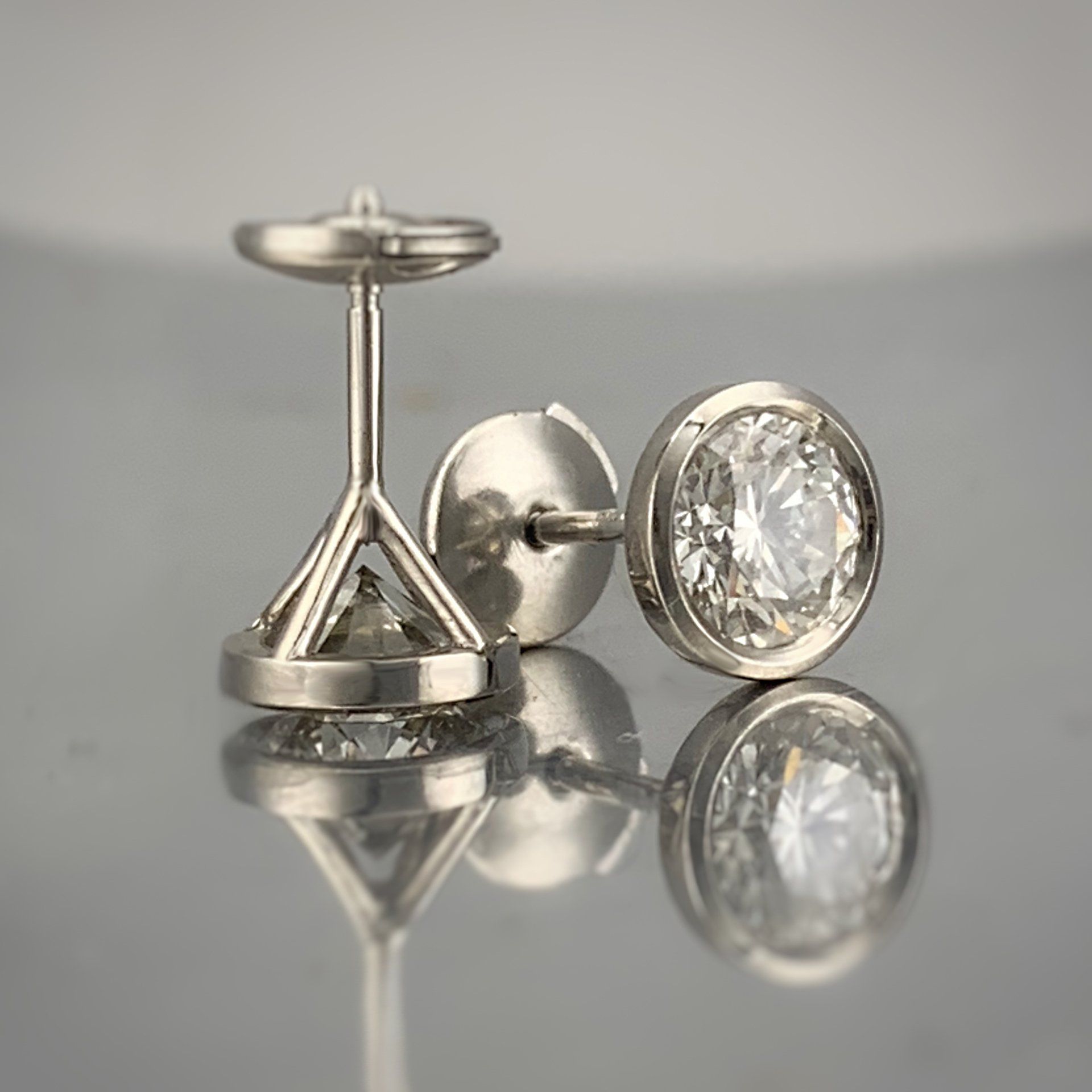A pair of cufflinks with a diamond in the center