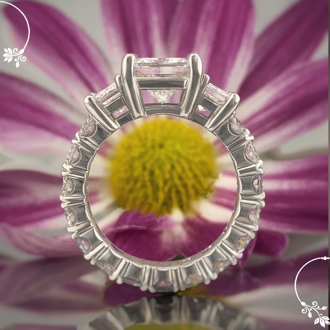 A ring with a purple flower in the background