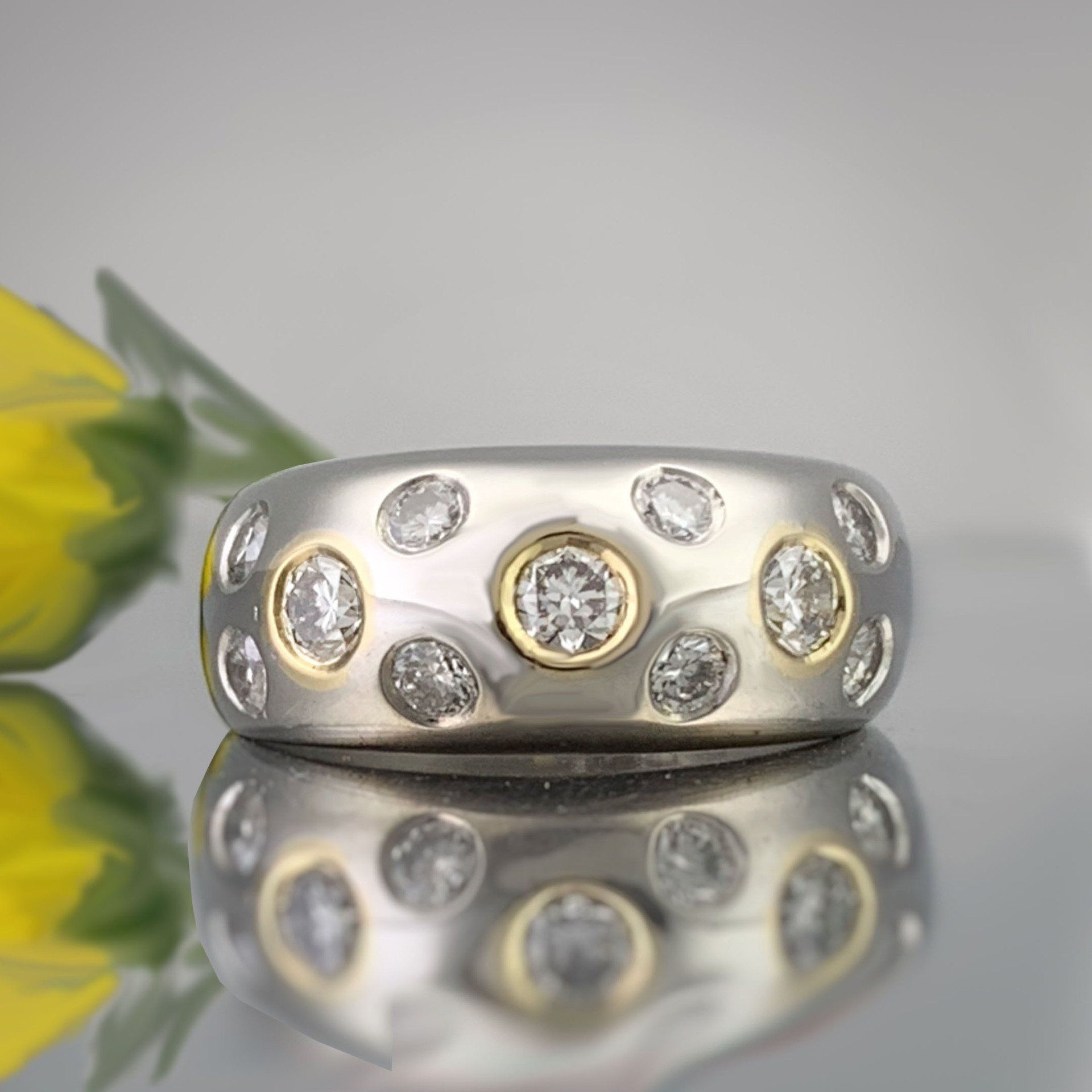 A close up of a ring with diamonds on it