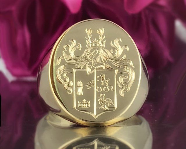 custom hand engraved signet ring with family crest