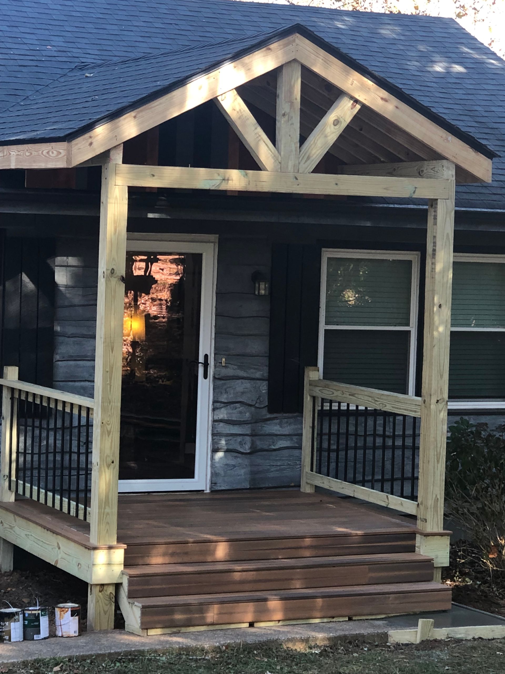 A house with a wooden porch and stairs