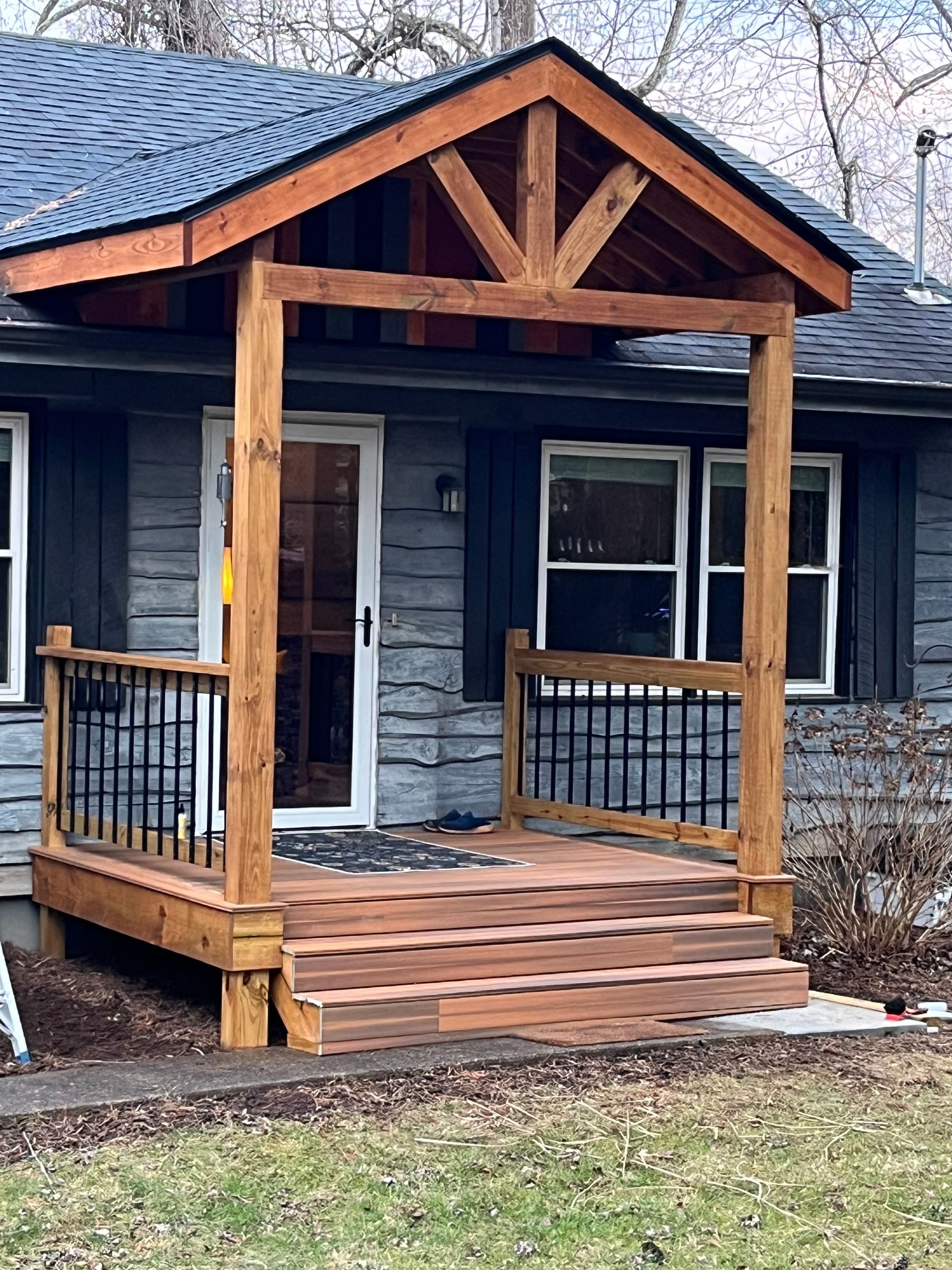 A house with a wooden porch and stairs