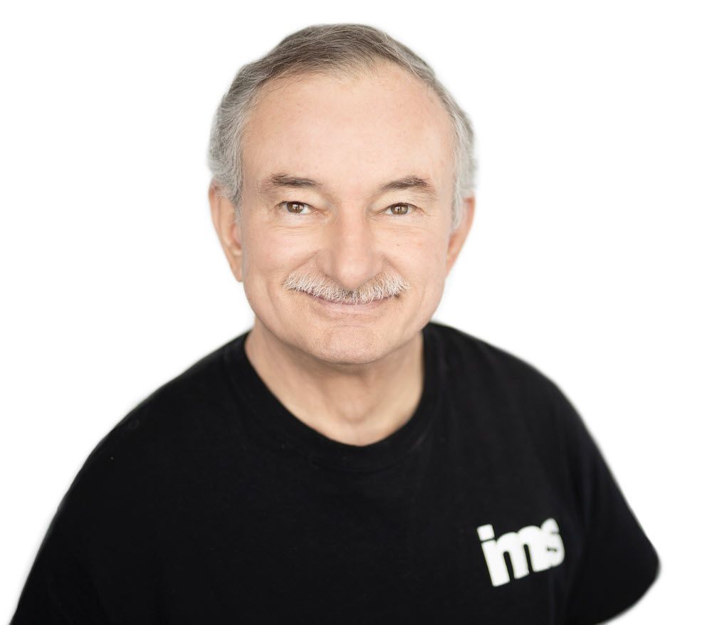 Agency founder Ben is wearing a black shirt with the word ims on it