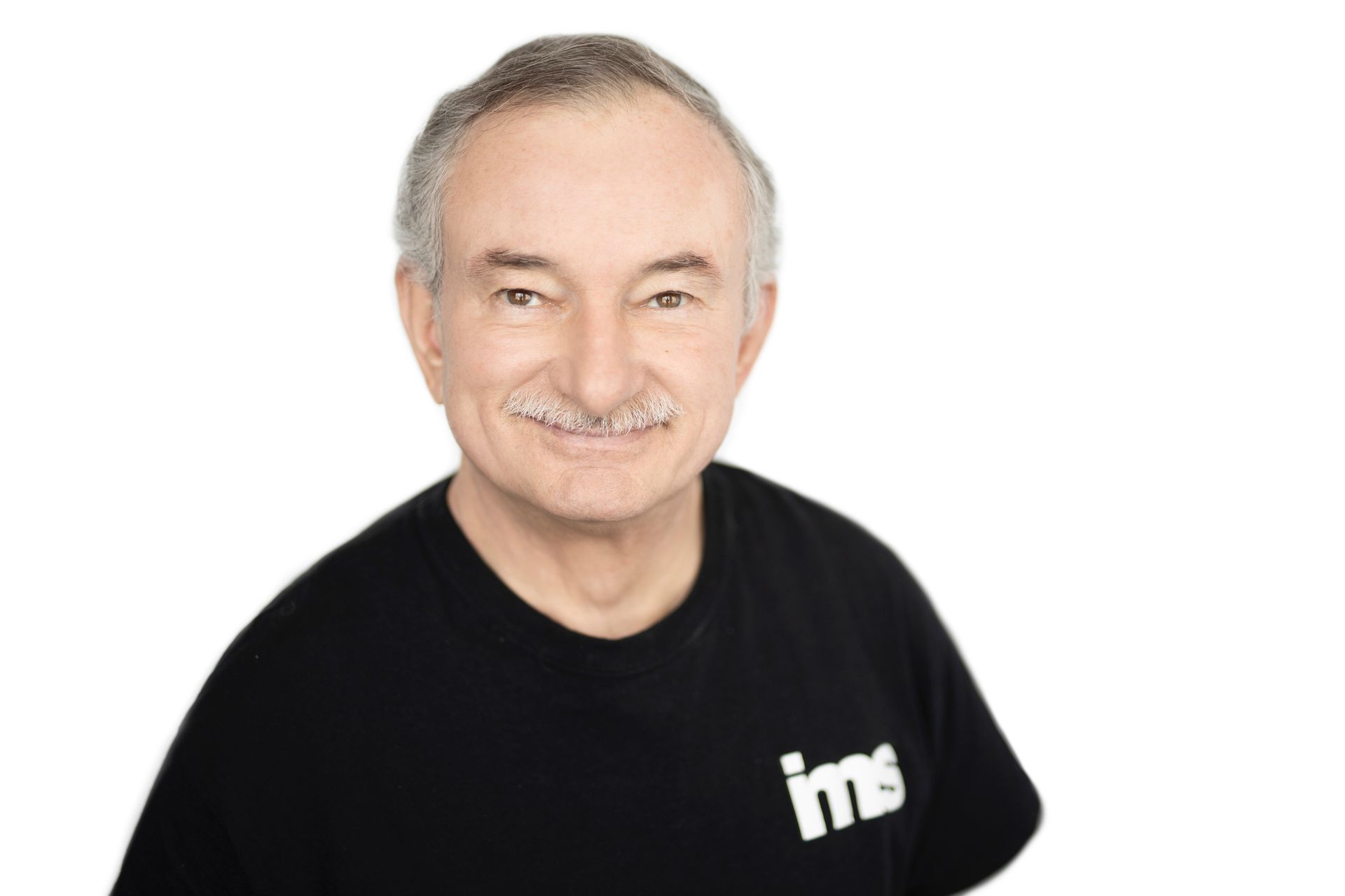 Agency founder Ben is wearing a black shirt with the word ims on it
