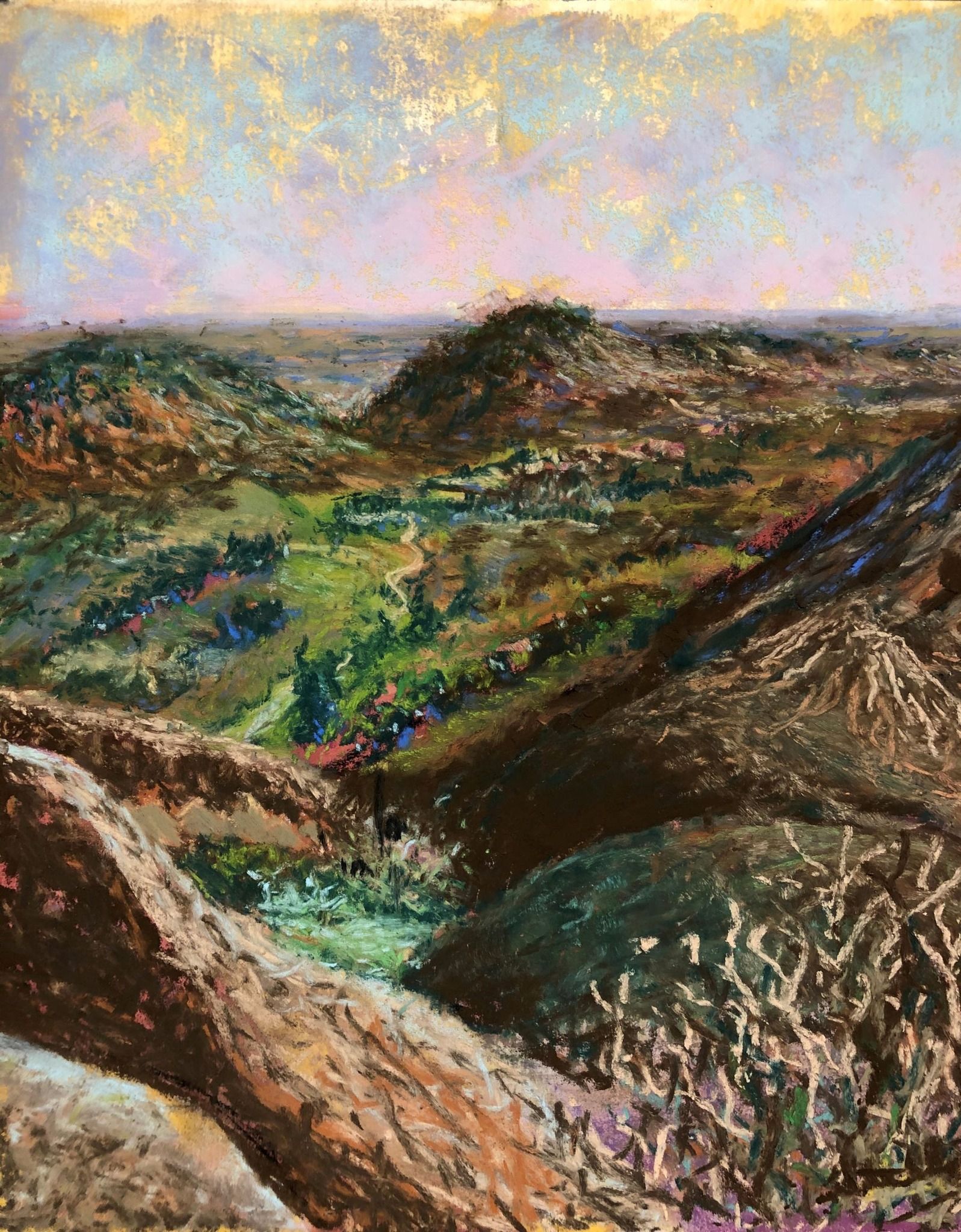 Rolling landscape with hills, greenery, and a colorful sky.