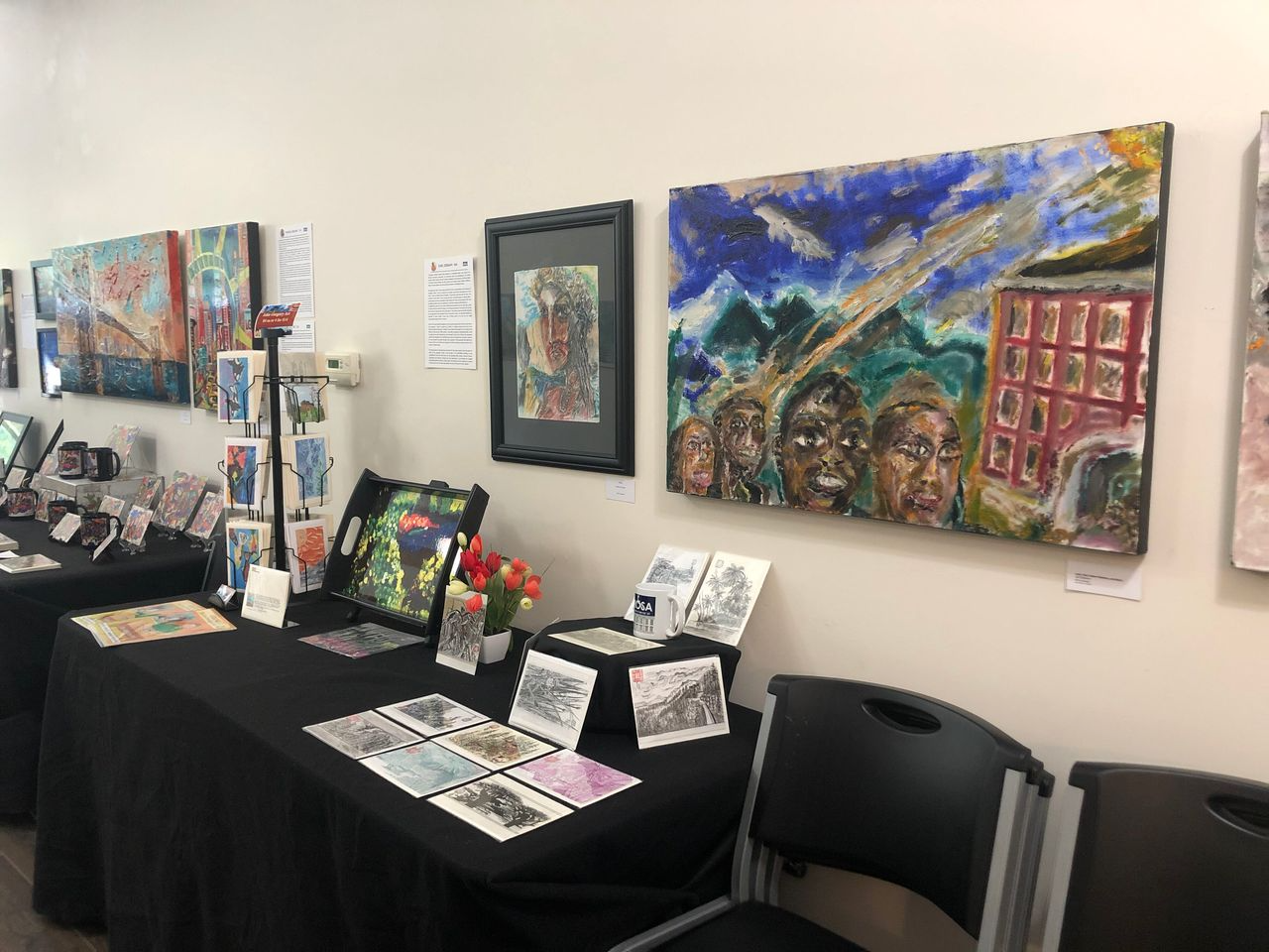 Abstract artwork with vibrant colors: yellow, red, orange, green, and blue brushstrokes on canvas.