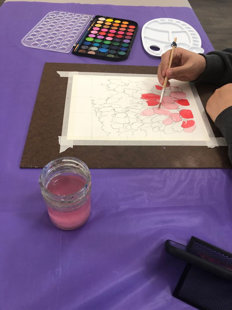 Silhouette of a tree on a hill against a large, glowing moon. Birds fly across the moon.