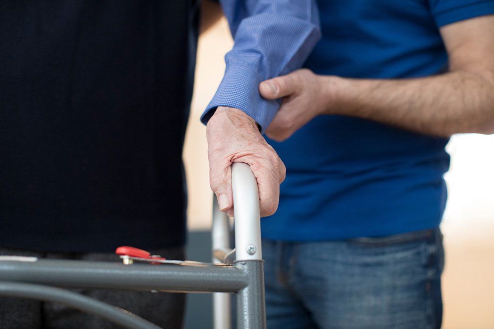 Home Care — Senior Man's Hands on Walking Frame in Columbus, OH