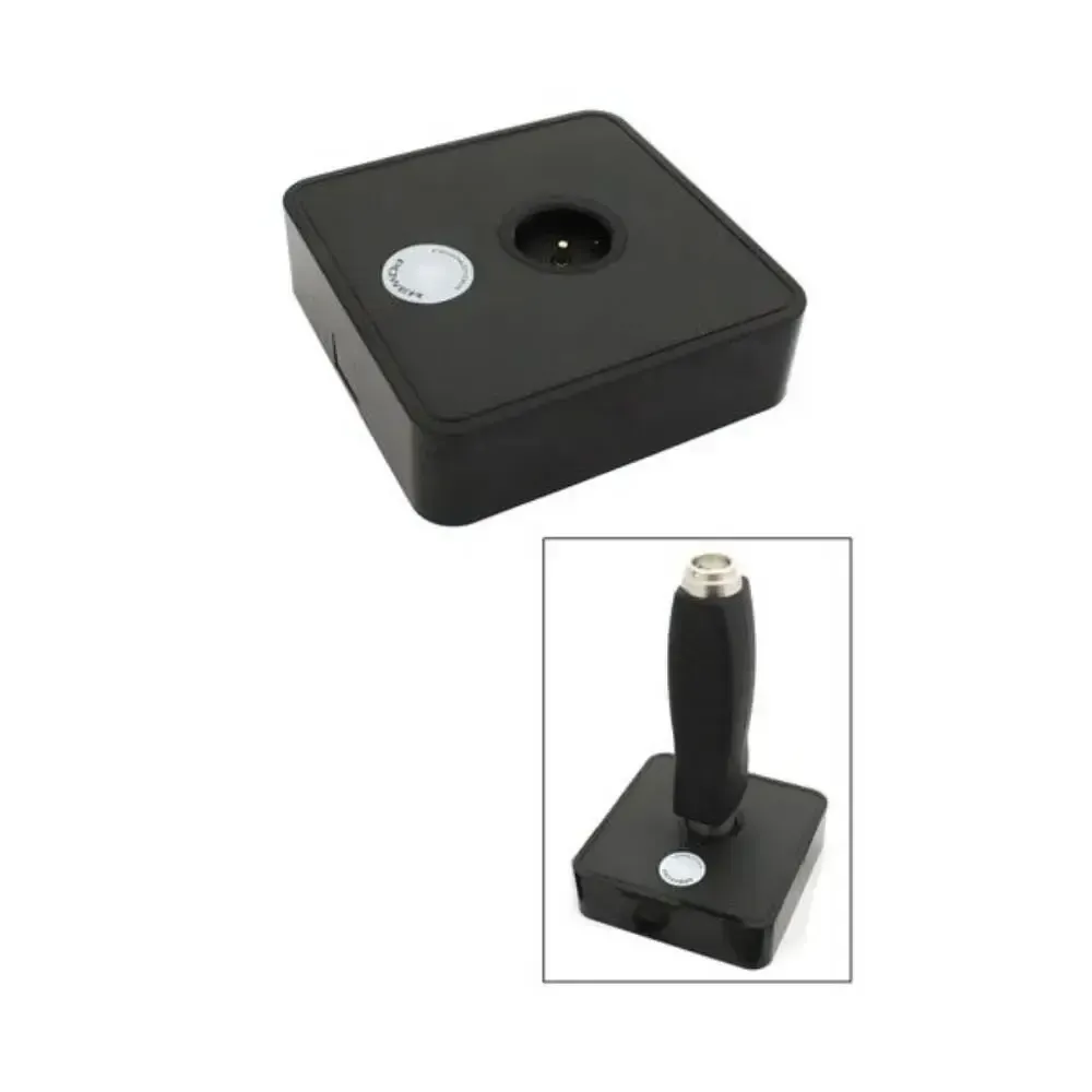 A black box with a white button on it