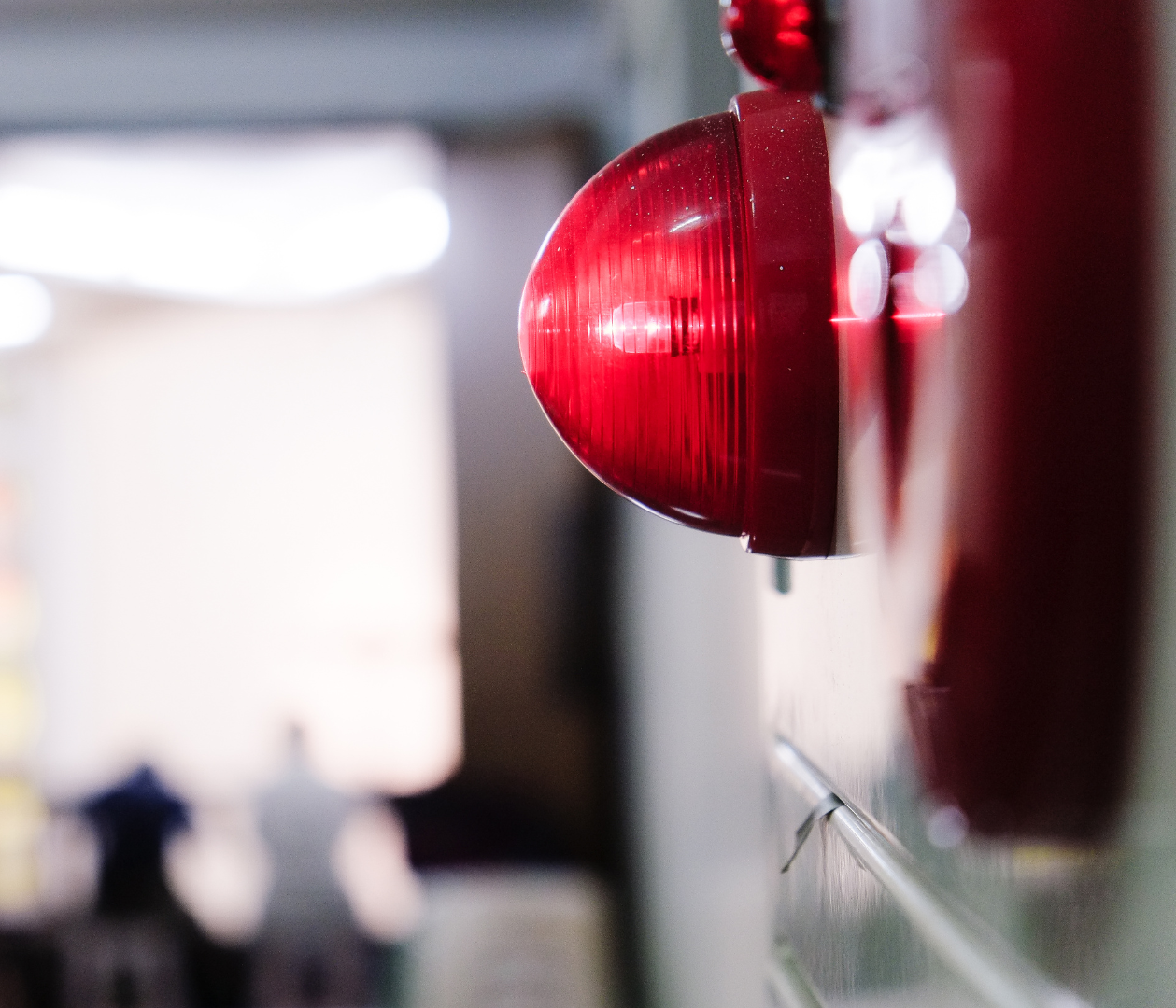 A close up of a red light on a wall
