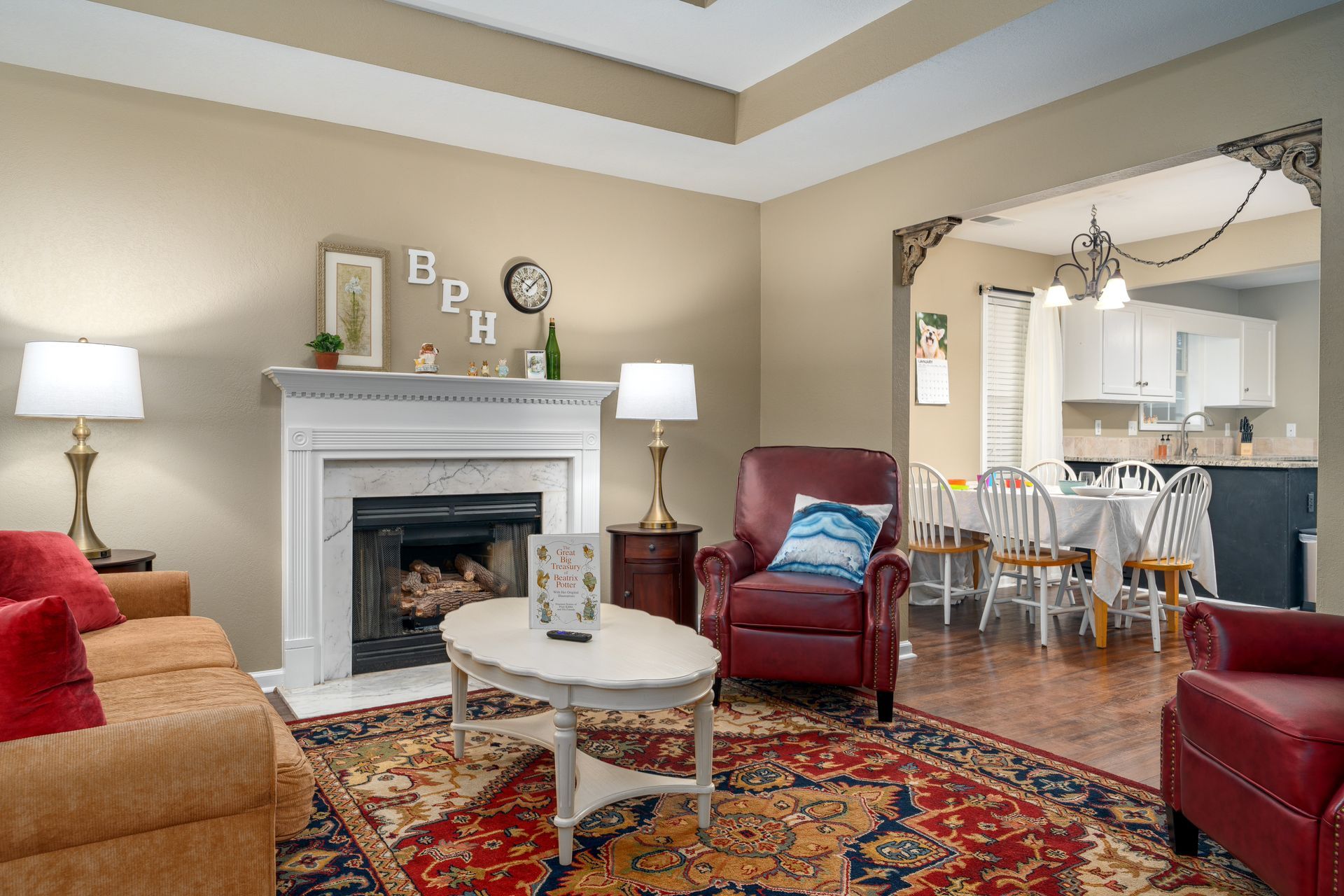 A living room filled with furniture and a fireplace.