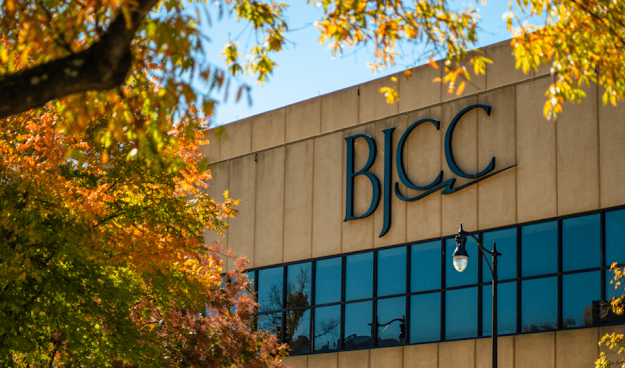 BJCC building with autumn foliage. Blue sky and sunny day.