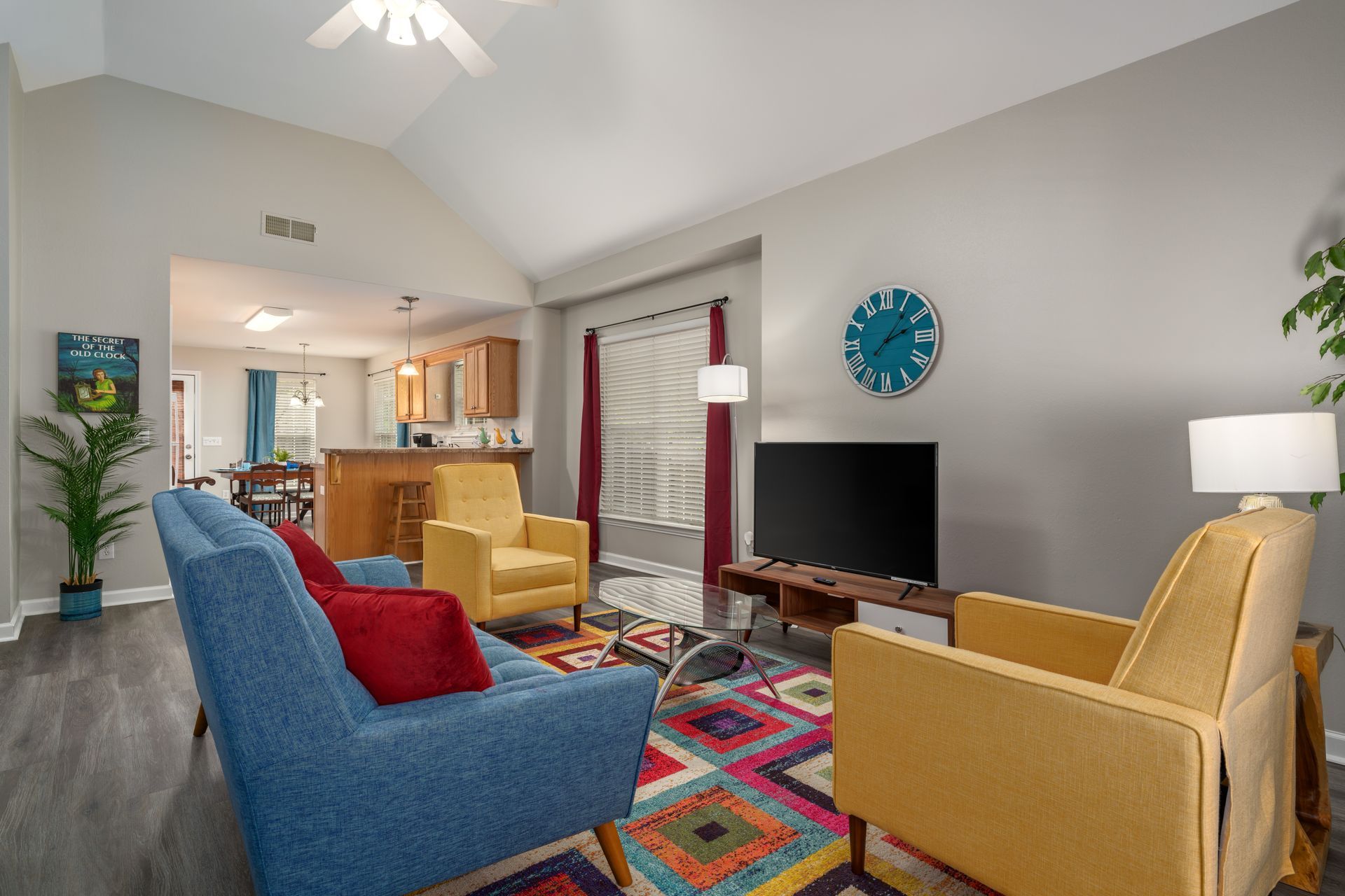 A living room filled with furniture and a flat screen tv.