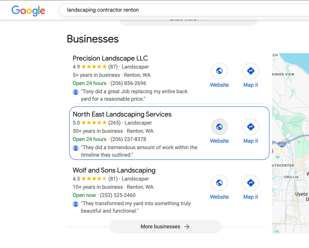 Laptop open on a marble table, with coffee, orange juice, and a hand reaching for the coffee.