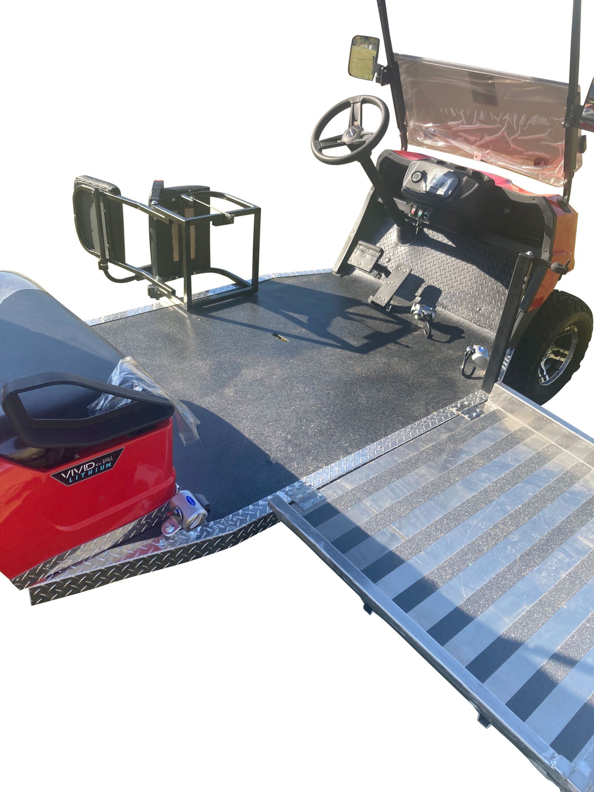 A golf cart with a lawn mower attached to it