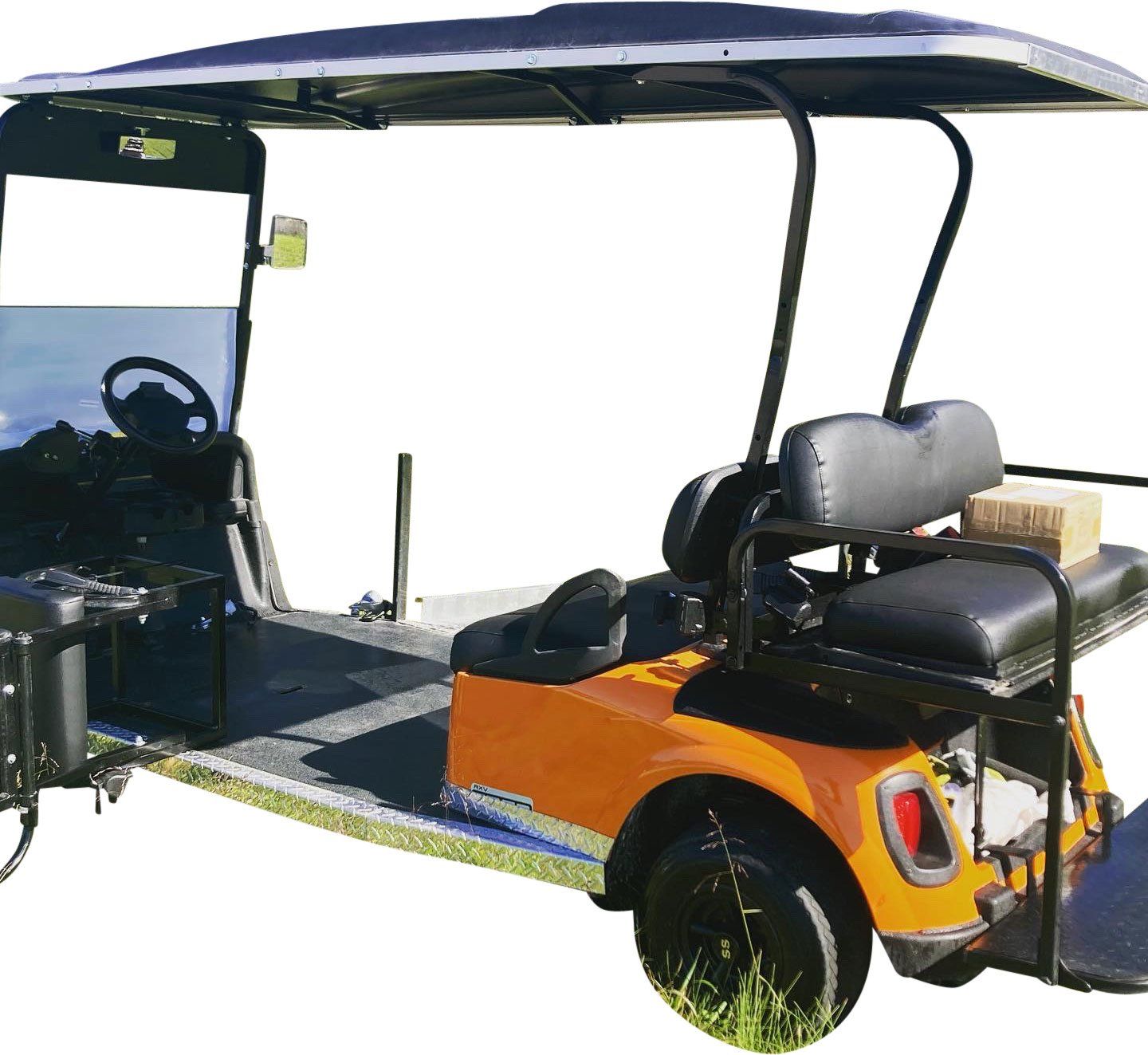 An orange golf cart with a black seat and a black roof