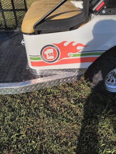 A golf cart with the number 1 on the side