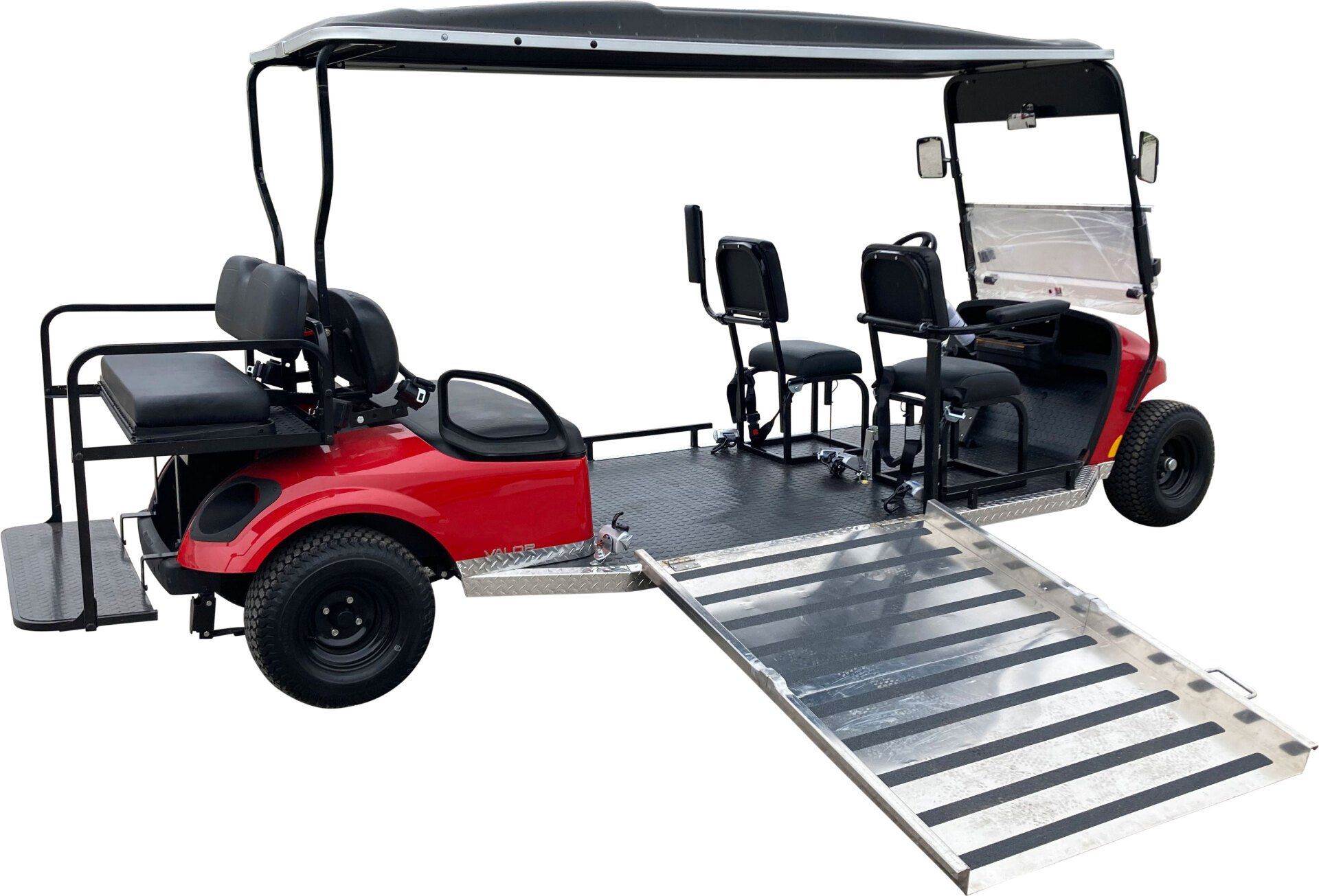 A red golf cart with a ramp attached to it.