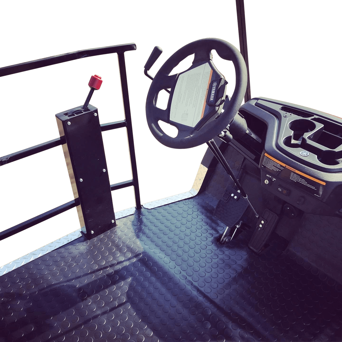 The inside of a golf cart with a steering wheel