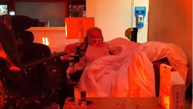 Disabled woman sleeps in hotel dining area