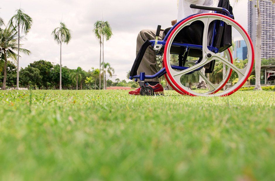 disabled man is sitting in a wheelchair