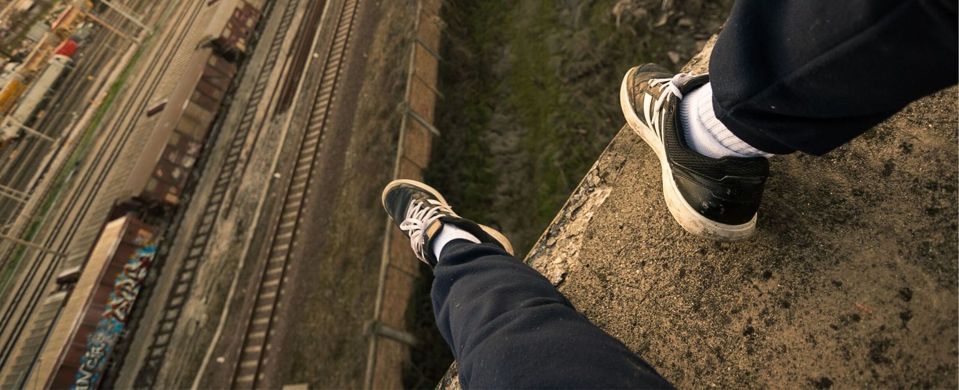Asylum seeker on railway bridge