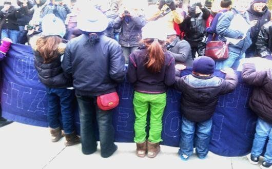 Children carry banner at demo