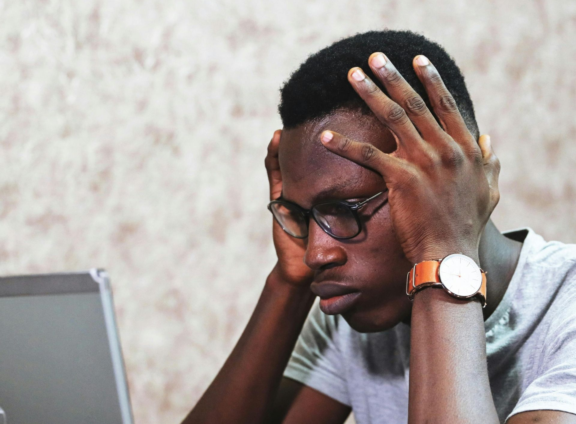 Stressed man at a laptop