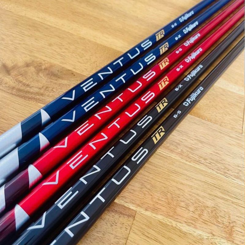 Golf club shafts: blue, red, and black with the word 
