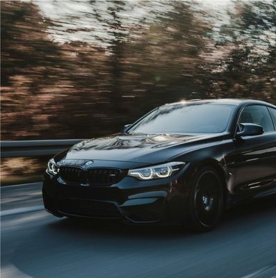 Black BMW On Road | J & C Automotive Inc