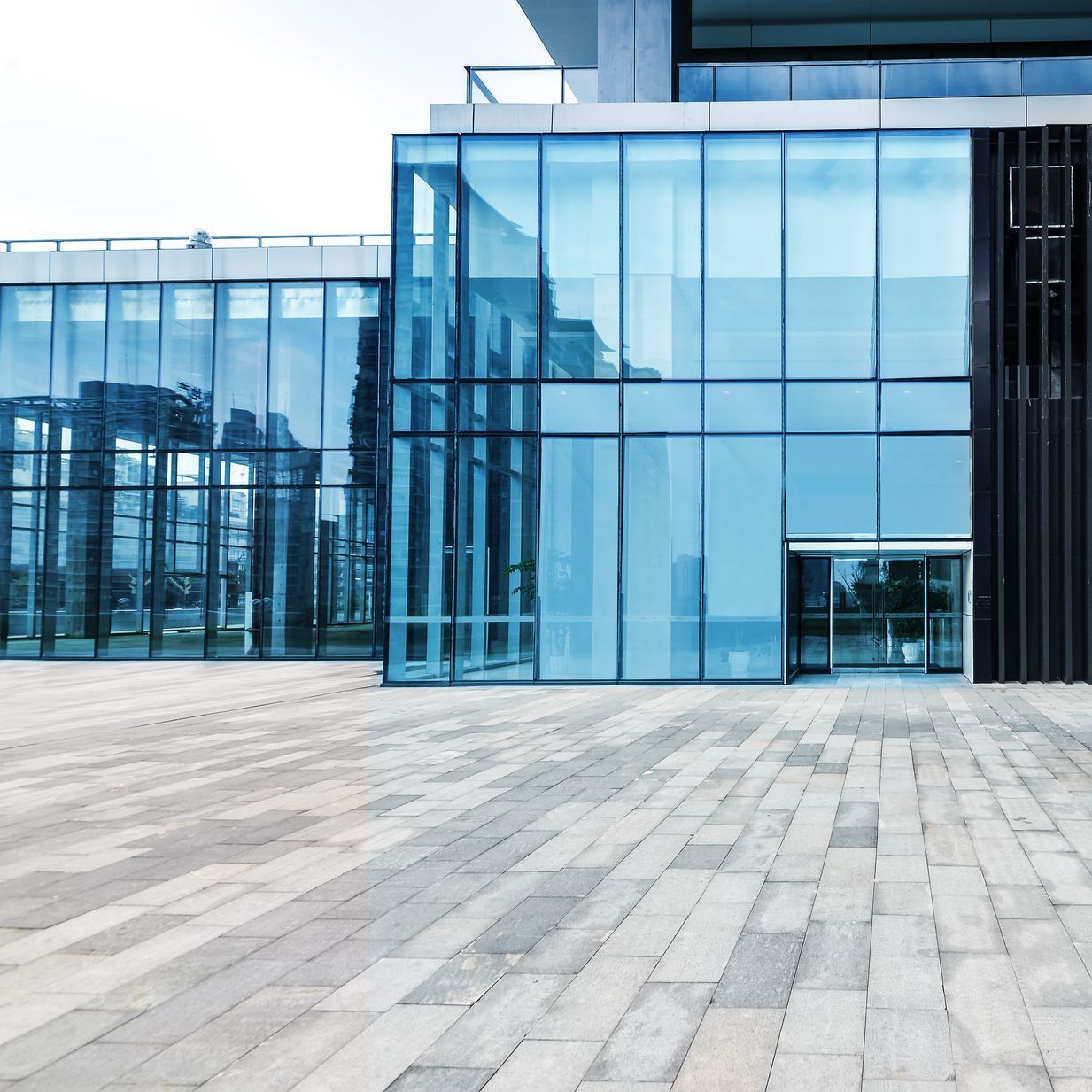 A large building with a lot of glass windows
