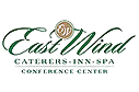 The logo for east wind caterers inn spa conference center.