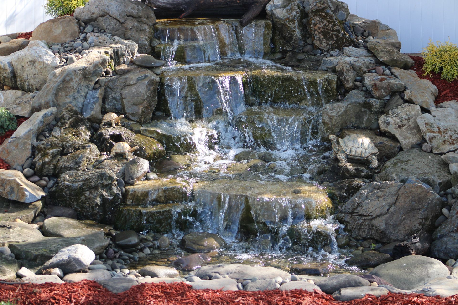 Waterfall cascading over rocky tiers.