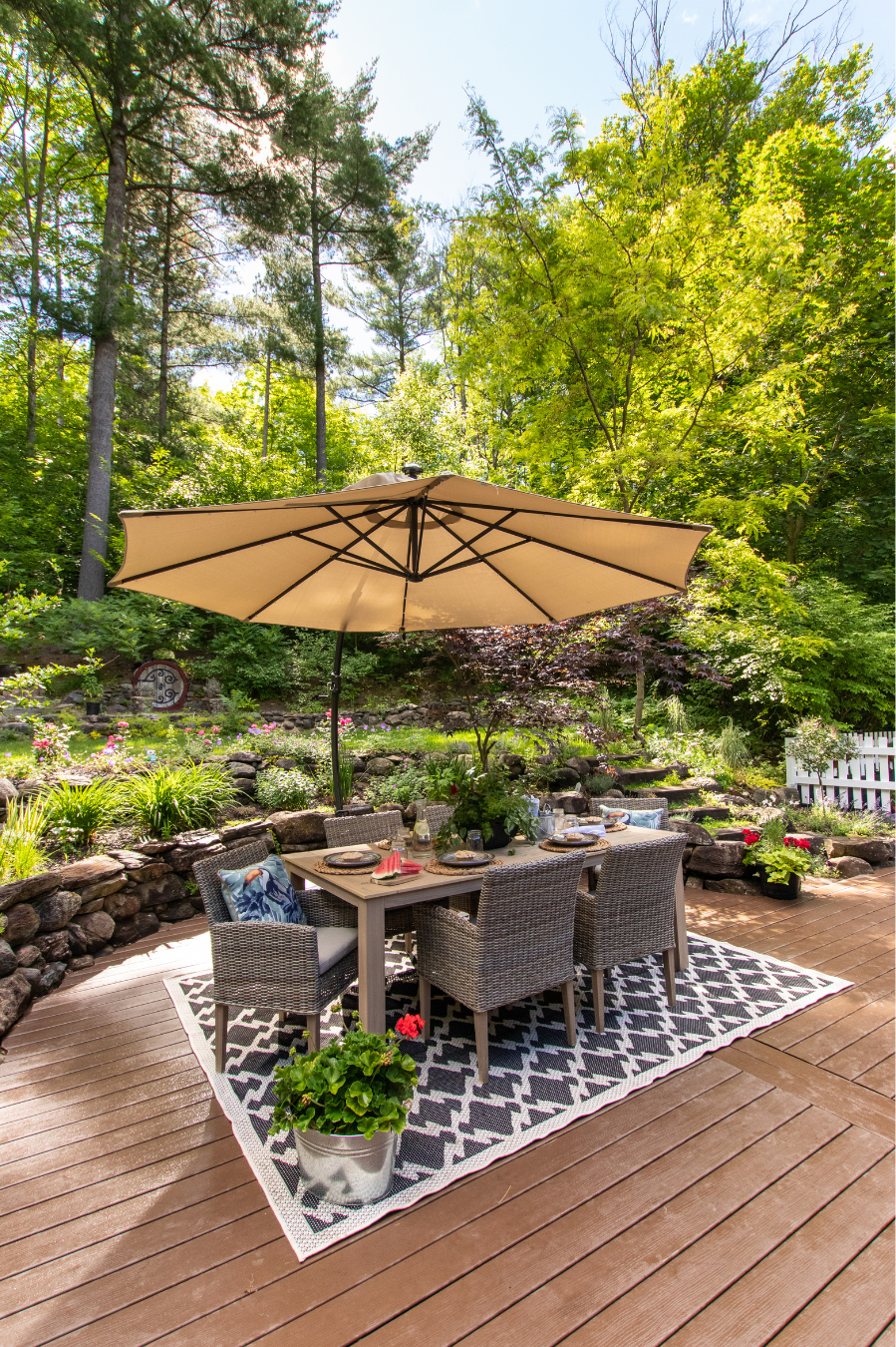 deck with table and umbrella