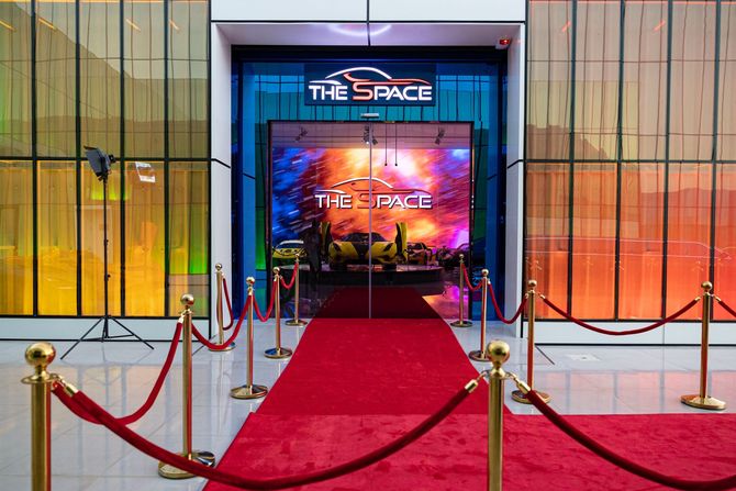 a red carpet is leading to the entrance of a building .